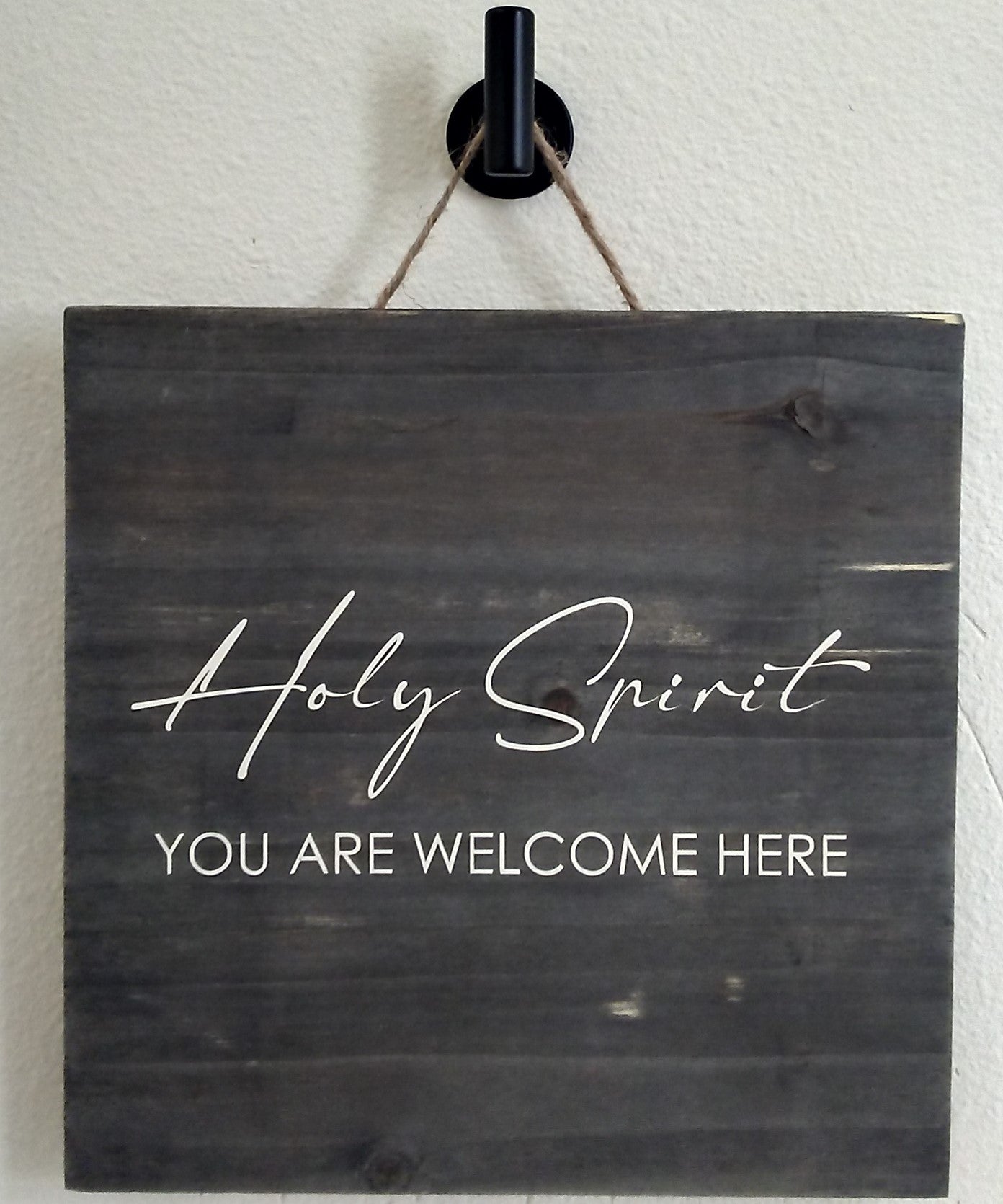 "Holy Spirit You are Welcome Here." Cream colored text on grey-brown square (10"x10") wood sign.