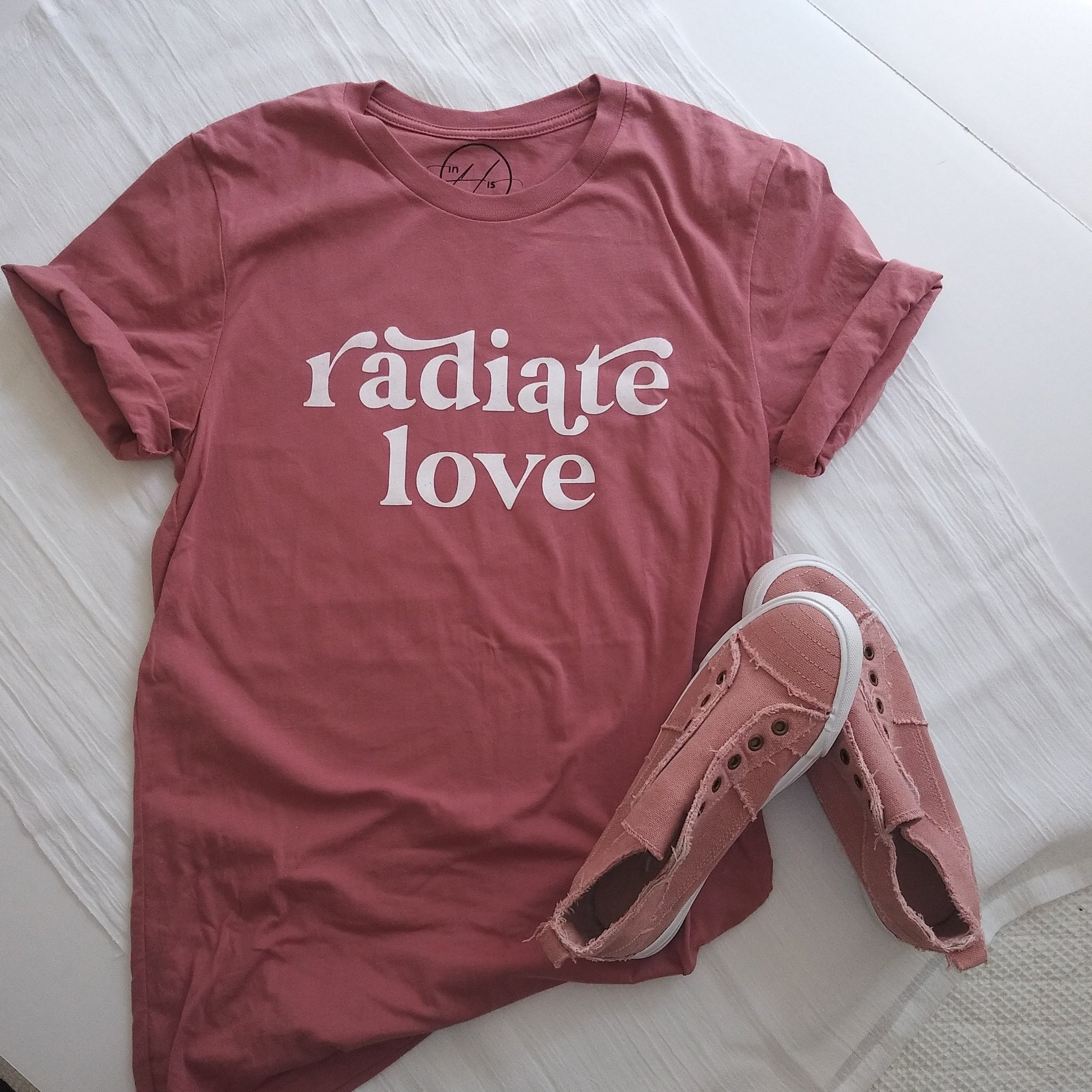 Mauve t-shirt with white text "radiate love" on front, upper center.