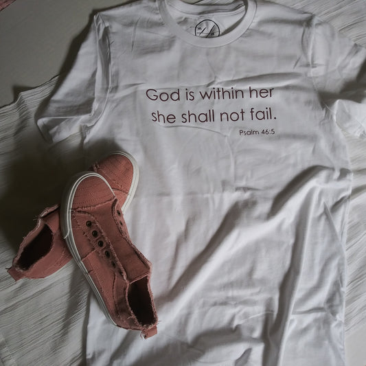 White t-shirt with Mauve reflective lettering: God is within her, she shall not fail (Psalm 46:5) on front, upper-middle. 